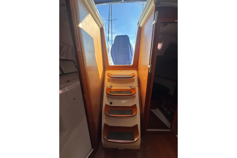 Slide: The Image of Interior stairs of 2014 Beneteau Oceanis 34 sailboat, leading to deck. - 34