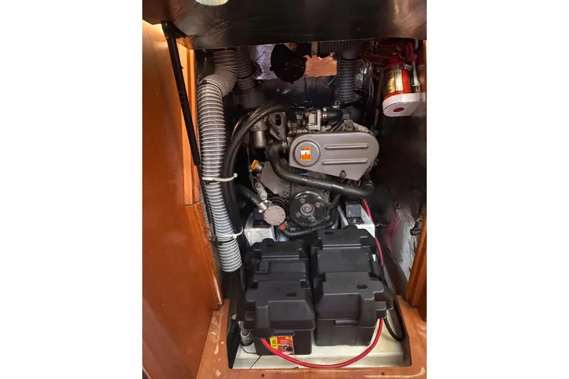 Slide: The Image of Engine compartment of a 2014 Beneteau Oceanis 34 sailboat, showcasing mechanical components. - 35