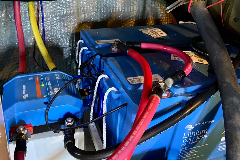 Slide: The Image of Engine compartment of a 1971 Hatteras 43 Double Cabin boat, showing mechanical components. - 100