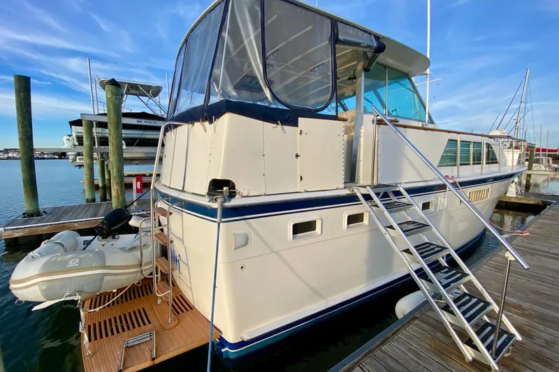 Slide: The Image of Inflatable Zodiac boat docked beside a 1971 Hatteras 43 Double Cabin yacht. - 16