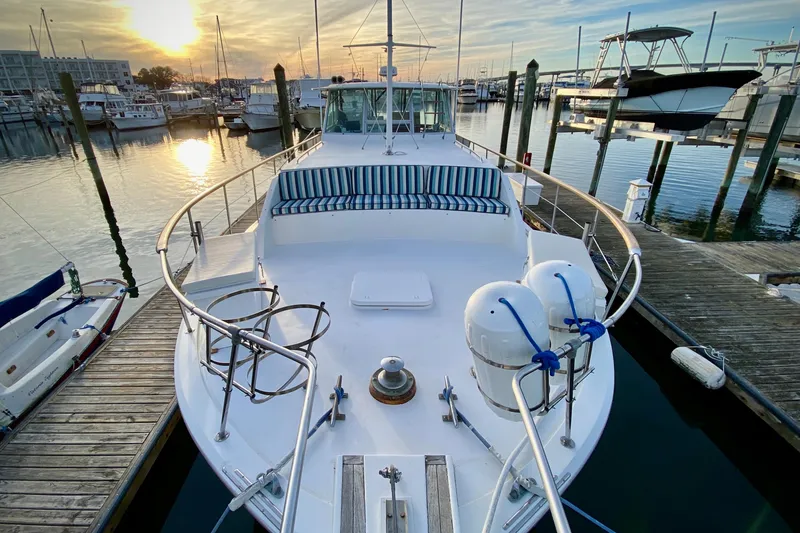 Slide: The Image of 1971 Hatteras 43 Double Cabin yacht docked at marina, side view. - 26