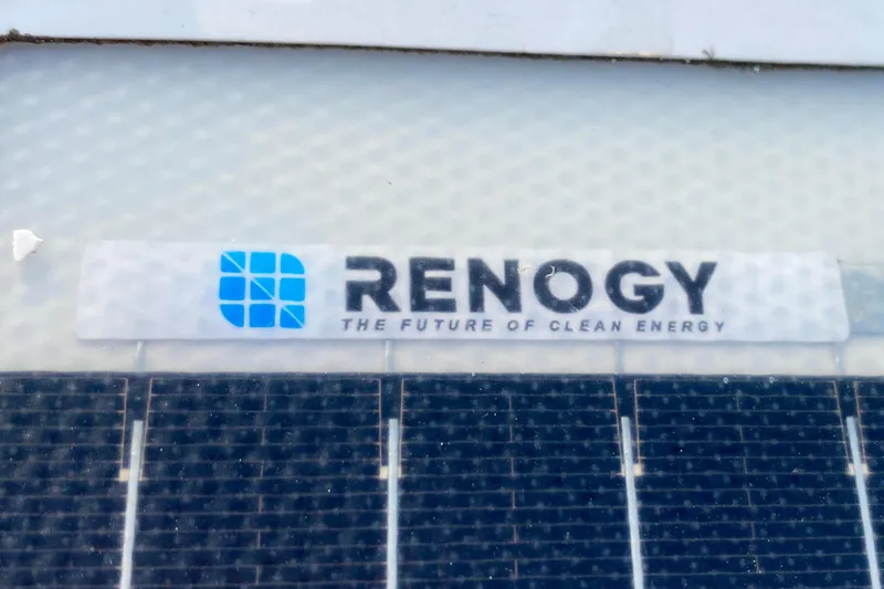 Slide: The Image of 1971 Hatteras 43 Double Cabin yacht docked at marina, showcasing sleek design and windows. - 30