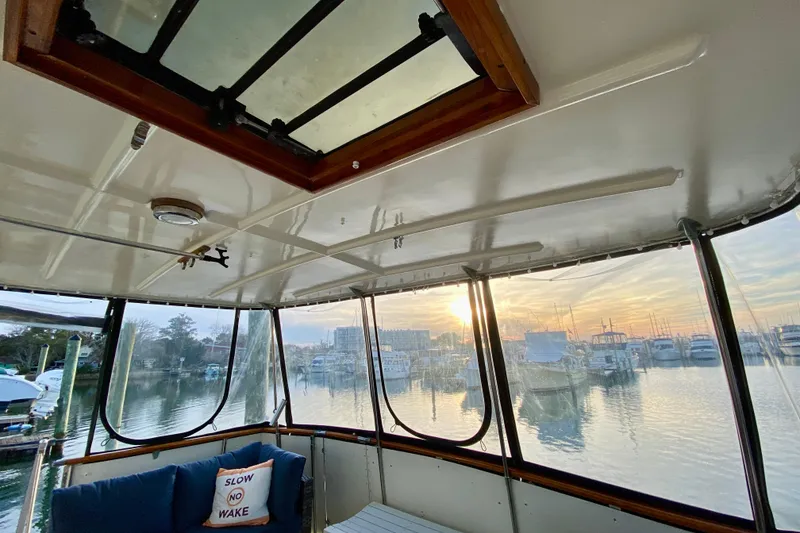 Slide: The Image of 1971 Hatteras 43 Double Cabin yacht interior with mermaid decor and open hatch. - 35
