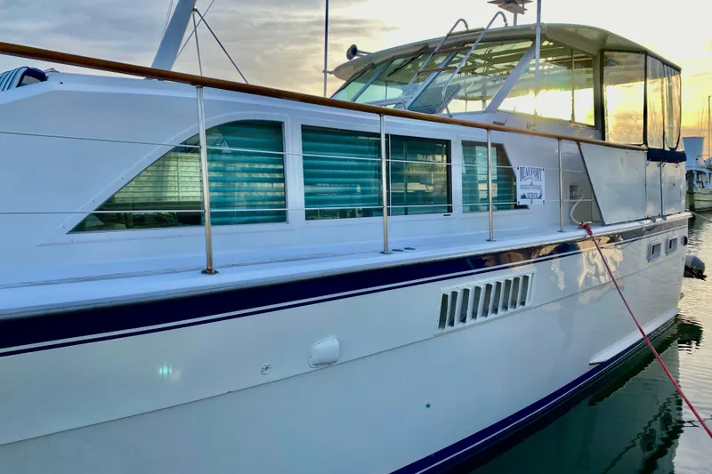 Slide: The Image of 1971 Hatteras 43 Double Cabin yacht docked with sales sign. - 4