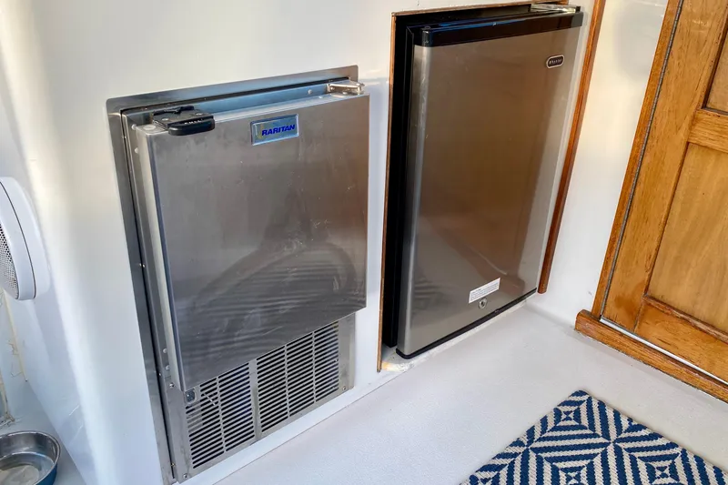 Slide: The Image of Interior of 1971 Hatteras 43 Double Cabin with cozy seating and nautical decor. - 42