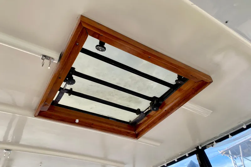 Slide: The Image of 1971 Hatteras 43 Double Cabin interior with cozy seating and elegant wood finishes. - 43