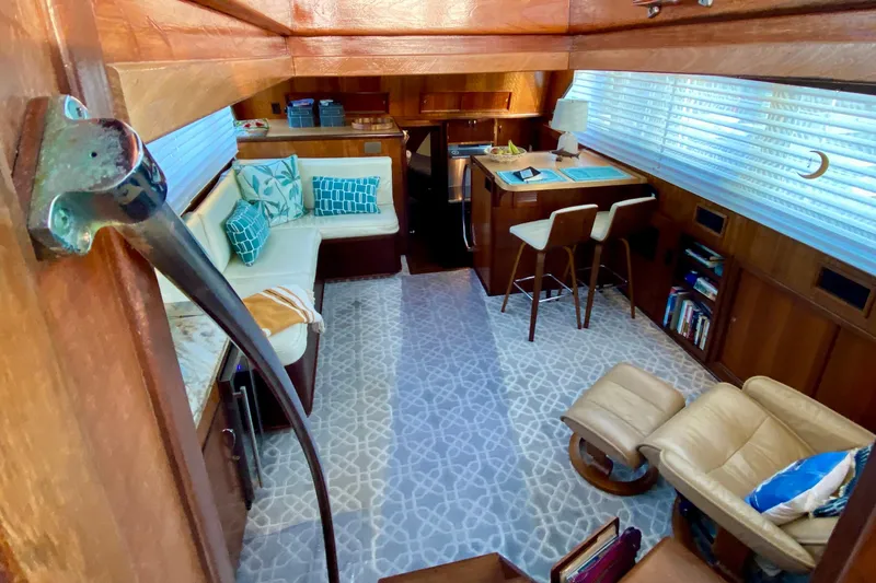 Slide: The Image of 1971 Hatteras 43 Double Cabin interior with elegant seating and marble countertop. - 44