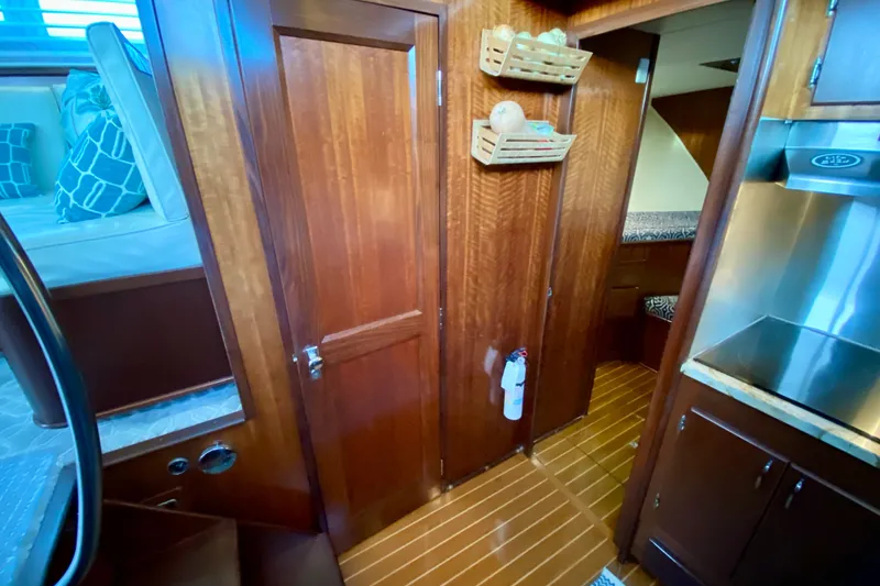 Slide: The Image of 1971 Hatteras 43 Double Cabin bathroom with wooden flooring and modern fixtures. - 58