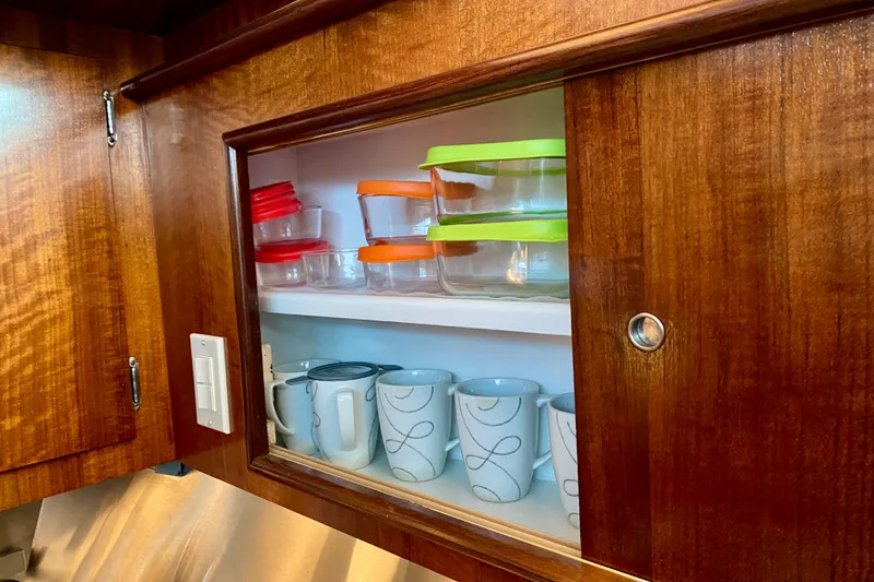 Slide: The Image of Wine cooler in 1971 Hatteras 43 Double Cabin interior with wooden cabinetry. - 69