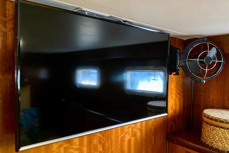 Slide: The Image of Bathroom interior of 1971 Hatteras 43 Double Cabin with marble countertop and wooden cabinetry. - 84
