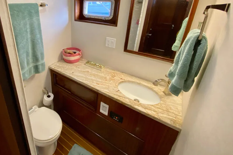 Slide: The Image of Shower area in 1971 Hatteras 43 Double Cabin yacht with tiled walls and curtain. - 86