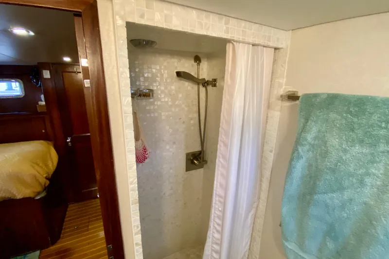 Slide: The Image of Shower area in 1971 Hatteras 43 Double Cabin yacht with tiled walls and floor. - 88