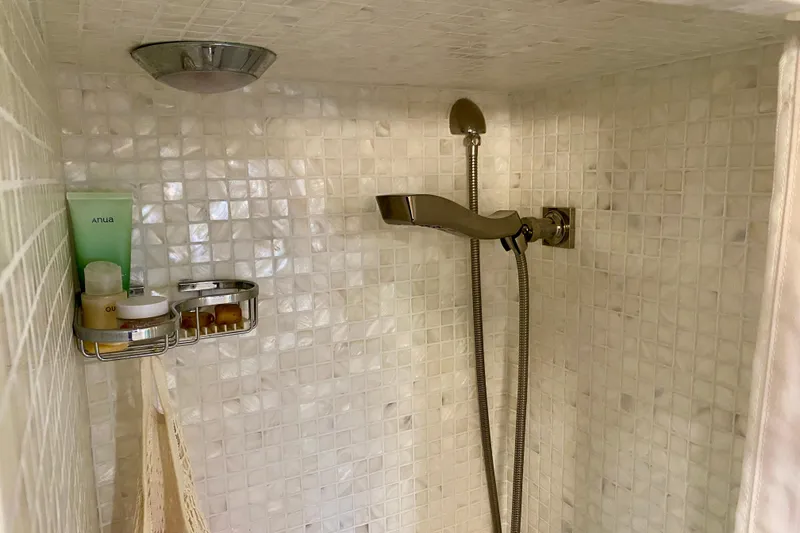 Slide: The Image of 1971 Hatteras 43 Double Cabin interior with wood paneling and cozy bed. - 89