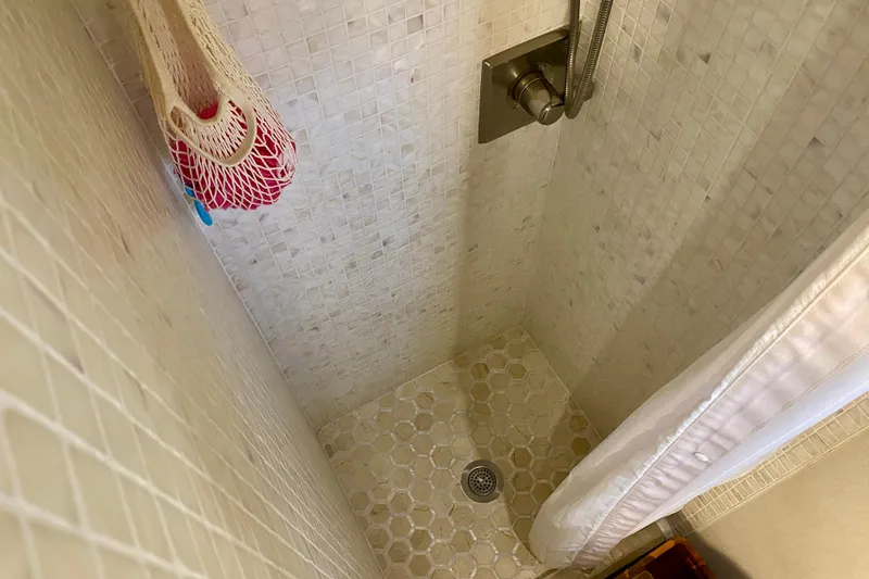 Slide: The Image of Interior of 1971 Hatteras 43 Double Cabin with wooden stairs and nautical decor. - 90