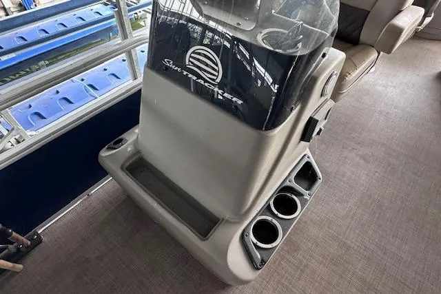 Slide: The Image of 2024 Sun Tracker Bass Buggy 18 DLX console with cup holders and seating area. - 10