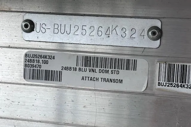 Slide: The Image of 2024 Sun Tracker Bass Buggy 18 DLX identification plate with serial numbers and barcodes. - 18