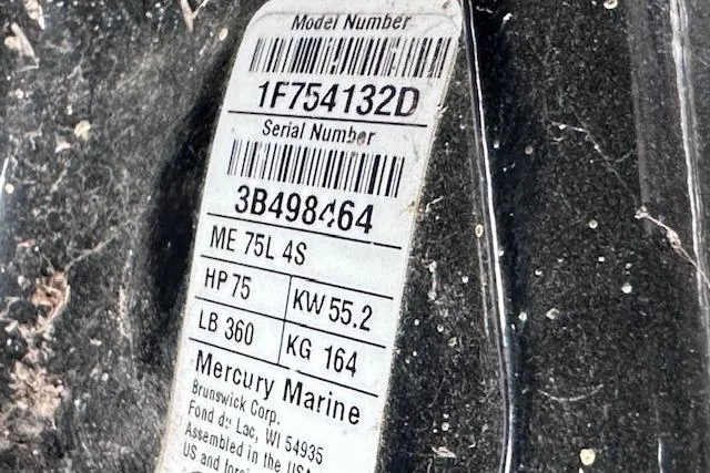 Slide: The Image of Label on 2024 Sun Tracker Bass Buggy 18 DLX, featuring Mercury Marine engine details. - 19