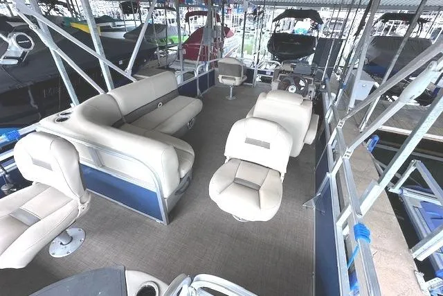 Slide: The Image of 2024 Sun Tracker Bass Buggy 18 DLX pontoon boat with spacious seating and modern design. - 6