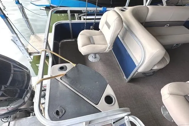 Slide: The Image of 2024 Sun Tracker Bass Buggy 18 DLX interior with seating and fishing platform. - 7