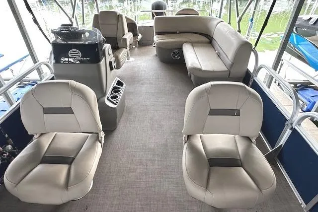 Slide: The Image of 2024 Sun Tracker Bass Buggy 18 DLX pontoon boat interior with spacious seating and helm. - 9