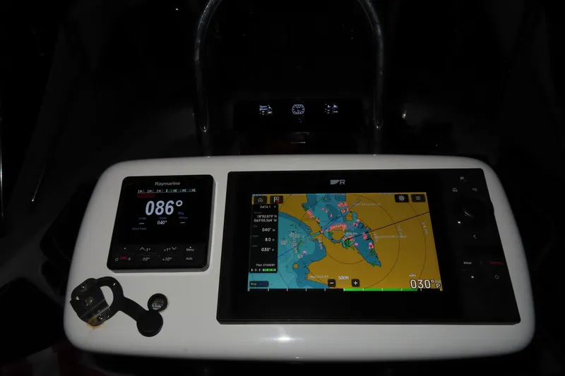 Slide: The Image of Navigation equipment on a 1998 Hylas 54' yacht, featuring digital displays and controls. - 12