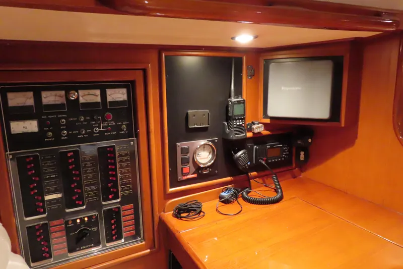Slide: The Image of Control panel of a 1998 Hylas 54' yacht with navigation and communication equipment. - 15