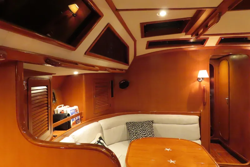 Slide: The Image of Luxurious interior of a 1998 Hylas 54' yacht with elegant wood finishes. - 16
