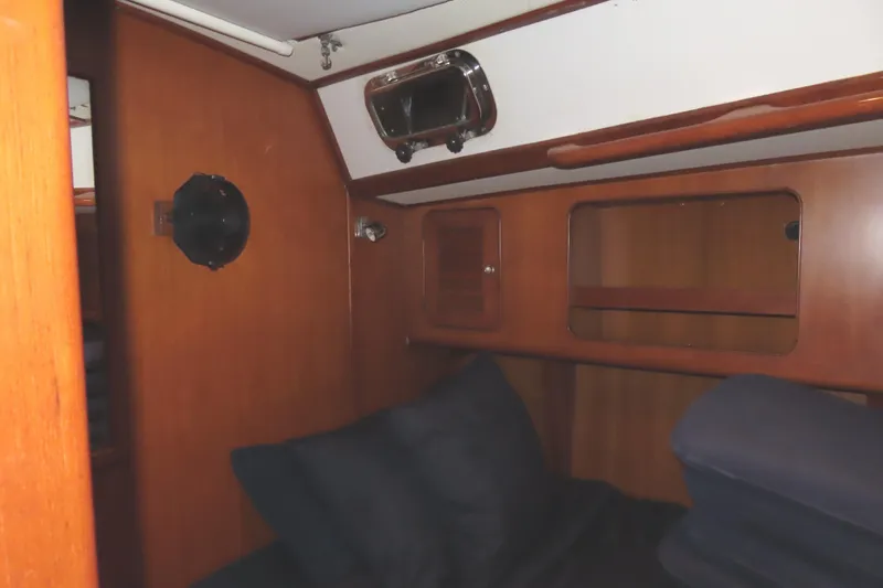 Slide: The Image of Cozy cabin interior of 1998 Hylas 54' yacht with wooden finish and porthole. - 20