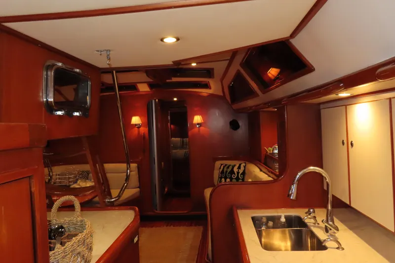 Slide: The Image of Luxurious interior of a 1998 Hylas 54' yacht with elegant wood finishes. - 23