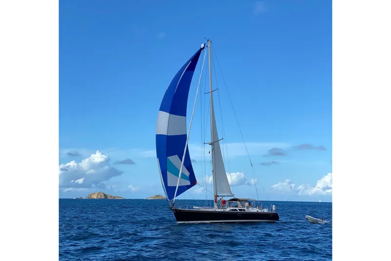 Slide: The Image of Sailing yacht Hylas 54' (1998) with blue spinnaker on open sea. - 29