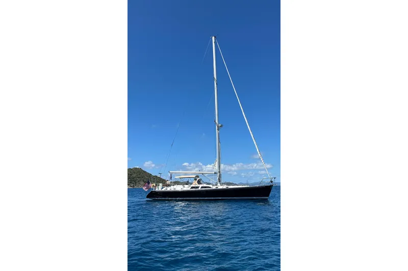 Slide: The Image of Sailing yacht on blue ocean, Hylas 54', 1998 model, under clear sky. - 3