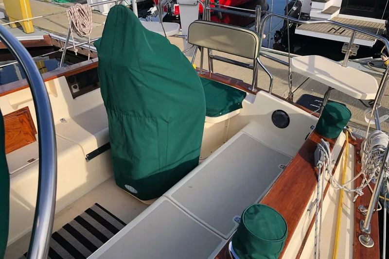 Slide: The Image of Cockpit with green covers and wooden accents. - 25