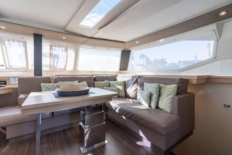 Slide: The Image of Luxurious interior of 2019 Fountaine Pajot 47 catamaran with modern seating and ample natural light. - 18
