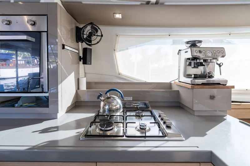 Slide: The Image of Modern kitchen in 2019 Fountaine Pajot 47 yacht with stove, oven, and espresso machine. - 23