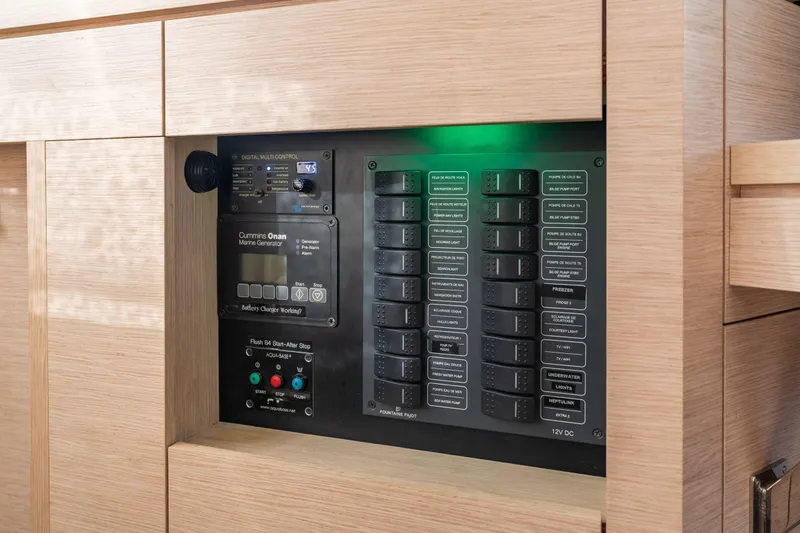 Slide: The Image of Control panel of a 2019 Fountaine Pajot 47 yacht, featuring marine generator controls. - 29