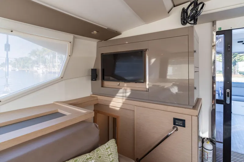 Slide: The Image of Interior of 2019 Fountaine Pajot 47 yacht with modern cabinetry and window view. - 31