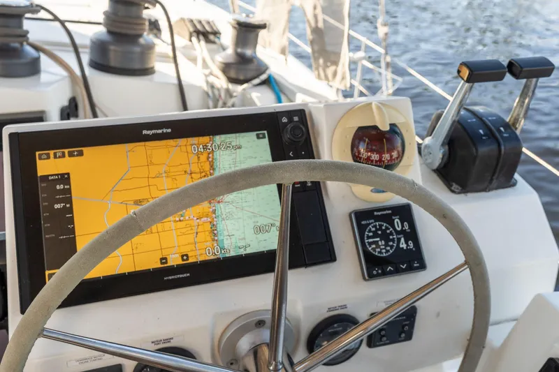 Slide: The Image of Cockpit of 2019 Fountaine Pajot 47 catamaran with navigation equipment and steering wheel. - 33