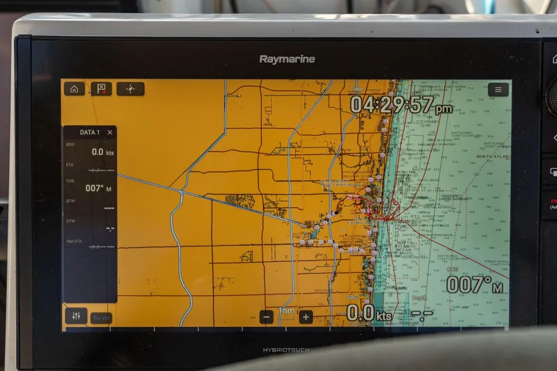 Slide: The Image of Navigation display on a 2019 Fountaine Pajot 47, showing coastal map and data. - 34