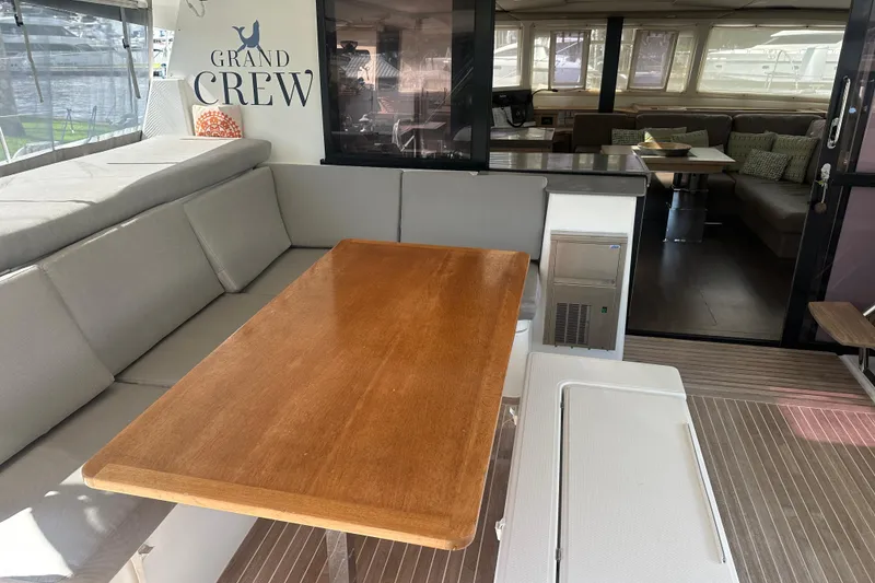 Slide: The Image of 2019 Fountaine Pajot 47 yacht interior with dining area and lounge seating. - 40