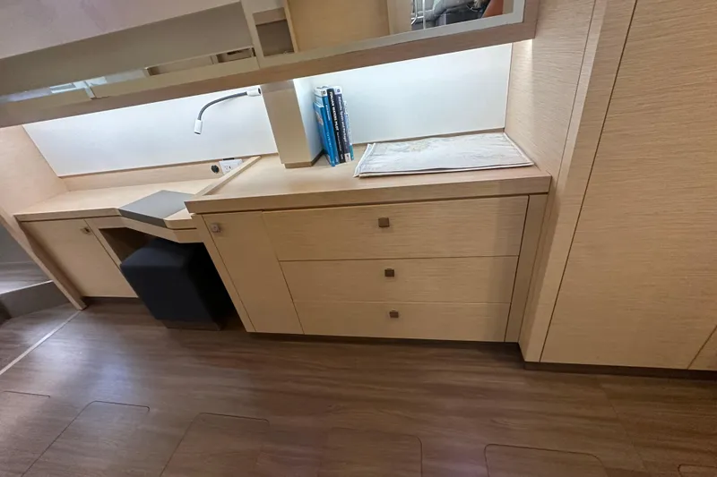 Slide: The Image of Modern interior of 2019 Fountaine Pajot 47 yacht with sleek cabinetry and workspace. - 49