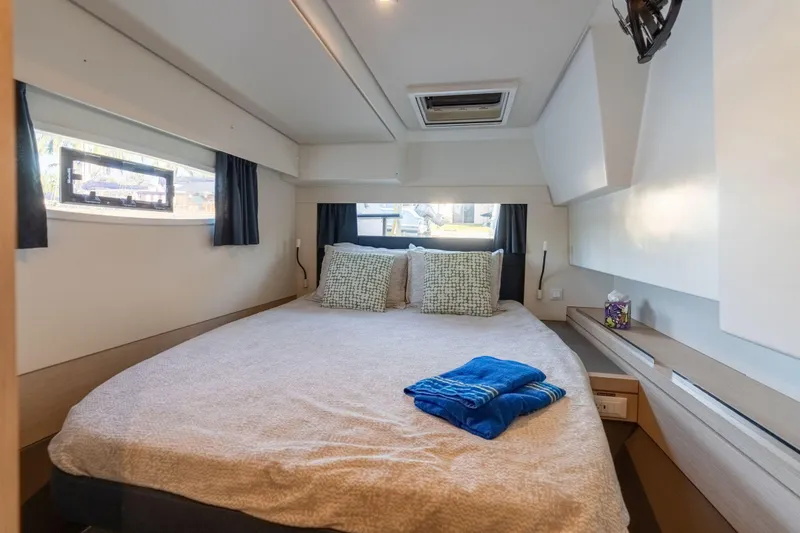 Slide: The Image of Luxurious cabin interior of 2019 Fountaine Pajot 47 catamaran with cozy bedding. - 51