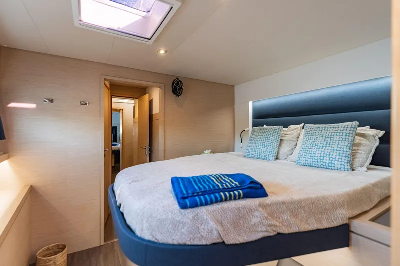 Slide: The Image of Luxurious bedroom interior of 2019 Fountaine Pajot 47 yacht with skylight and cozy bedding. - 58