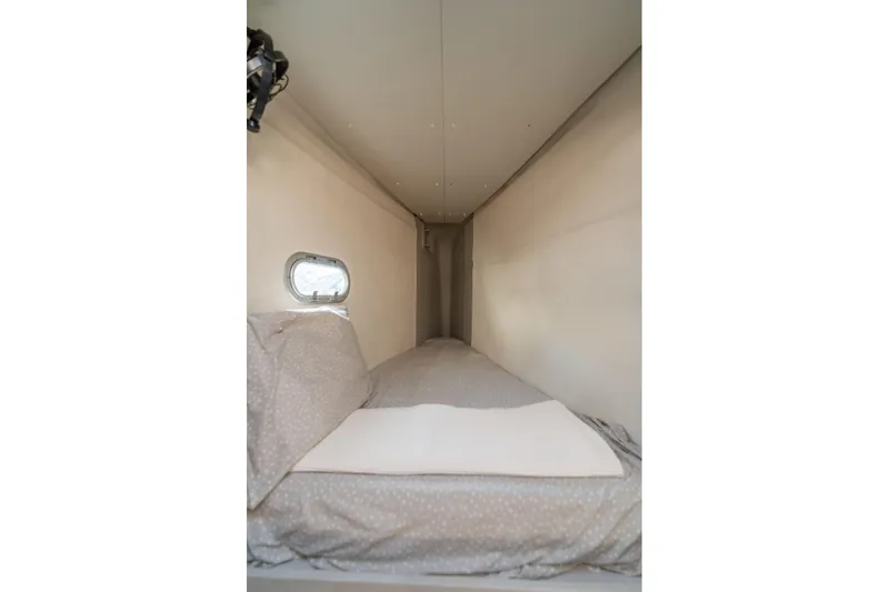 Slide: The Image of Cozy cabin bed in 2019 Fountaine Pajot 47 yacht with small window. - 61