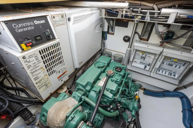 Slide: The Image of Engine room of 2019 Fountaine Pajot 47 with Cummins Onan generator and control panels. - 68