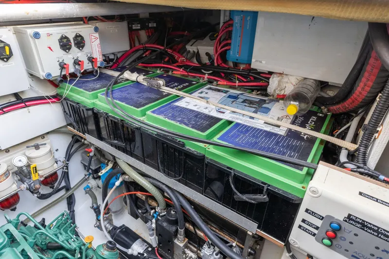 Slide: The Image of Engine room of 2019 Fountaine Pajot 47 catamaran with batteries and wiring. - 77