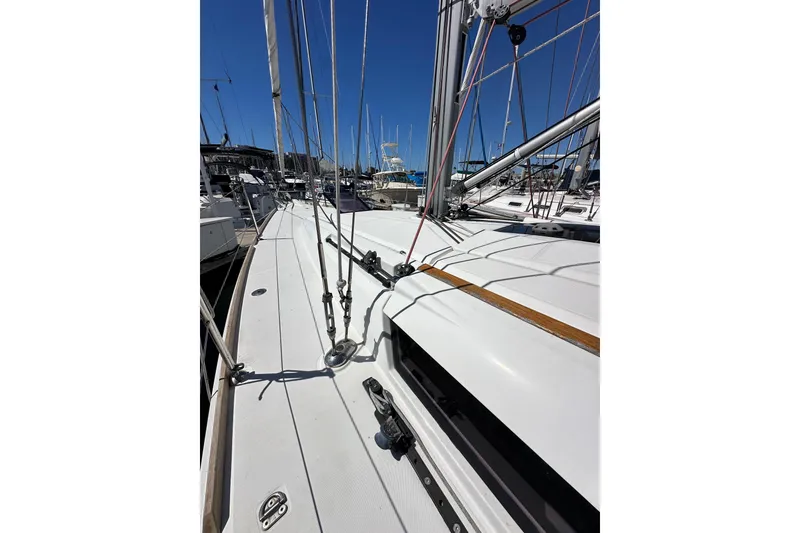 Slide: The Image of 2015 Jeanneau Sun Odyssey 409 sailboat deck with rigging in marina. - 15
