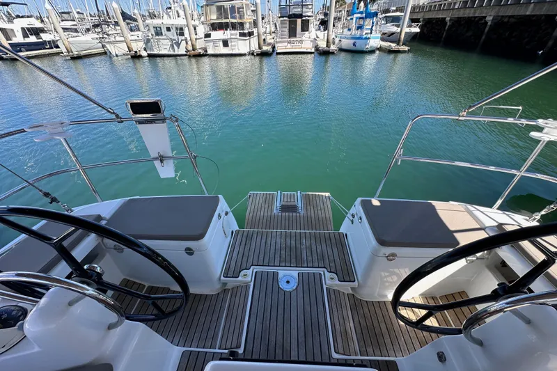 Slide: The Image of Cockpit view of 2015 Jeanneau Sun Odyssey 409 sailboat docked at marina. - 26