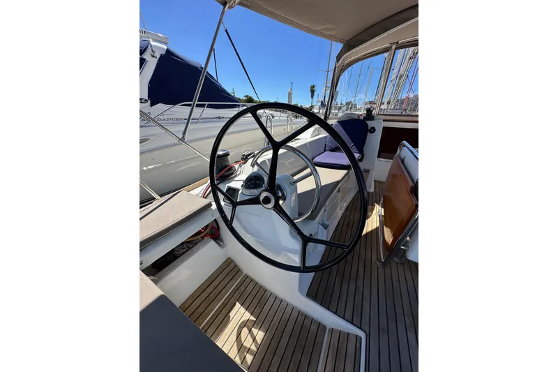 Slide: The Image of Steering wheel of 2015 Jeanneau Sun Odyssey 409 sailboat, docked in marina. - 31