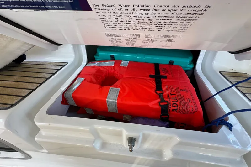 Slide: The Image of Storage compartment on Jeanneau Sun Odyssey 409 with life jacket and safety equipment, 2015 model. - 38