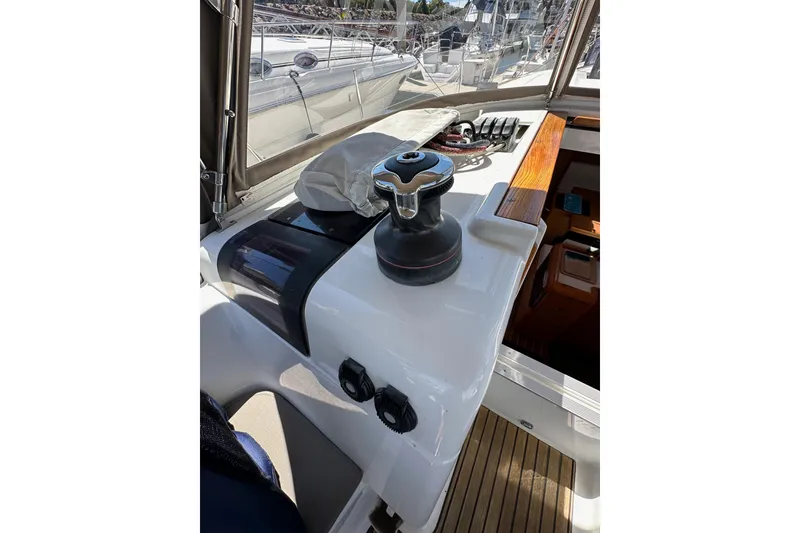 Slide: The Image of Cockpit view of 2015 Jeanneau Sun Odyssey 409 sailboat, featuring winch and control panel. - 39